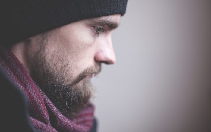 man in scarf and hat