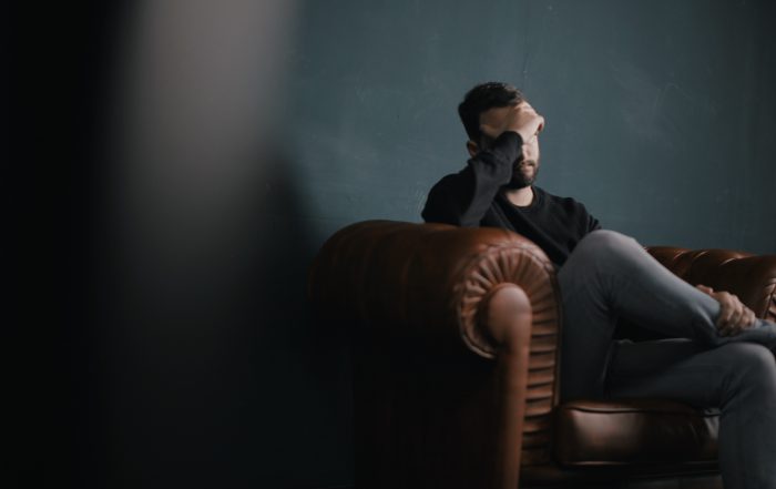 man on sofa sad